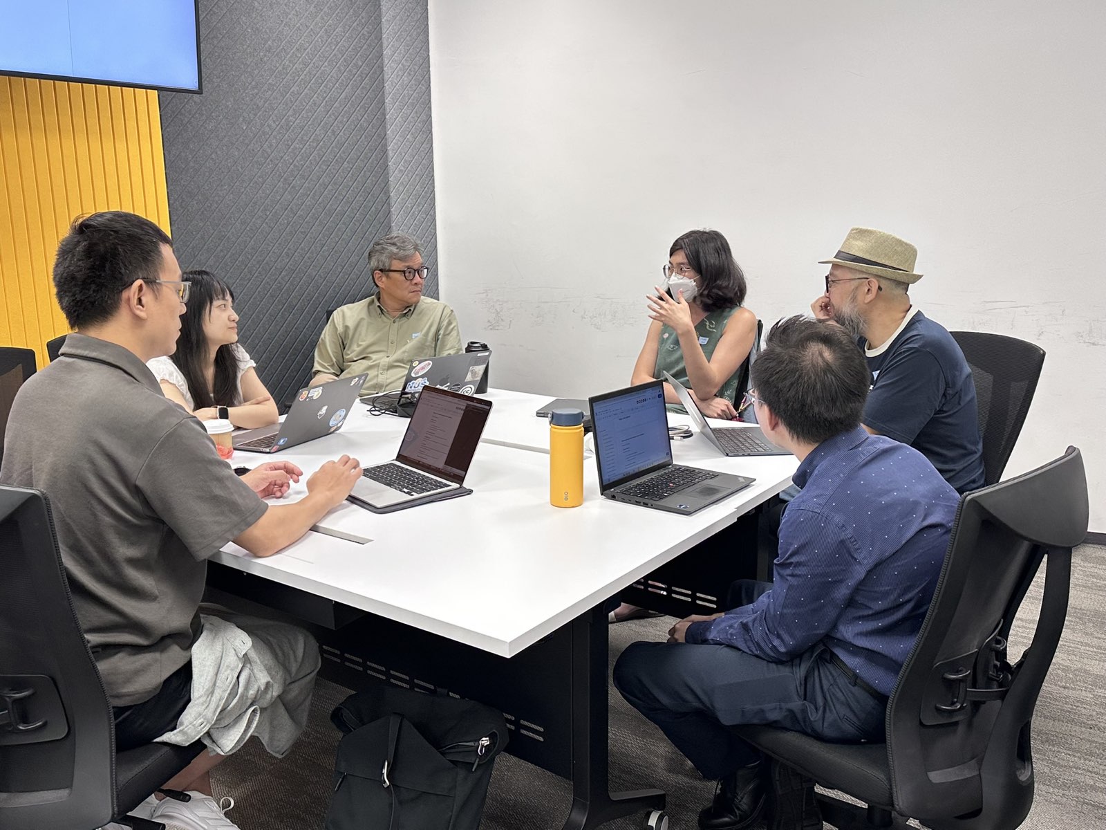 Small group breakout discussion around a table