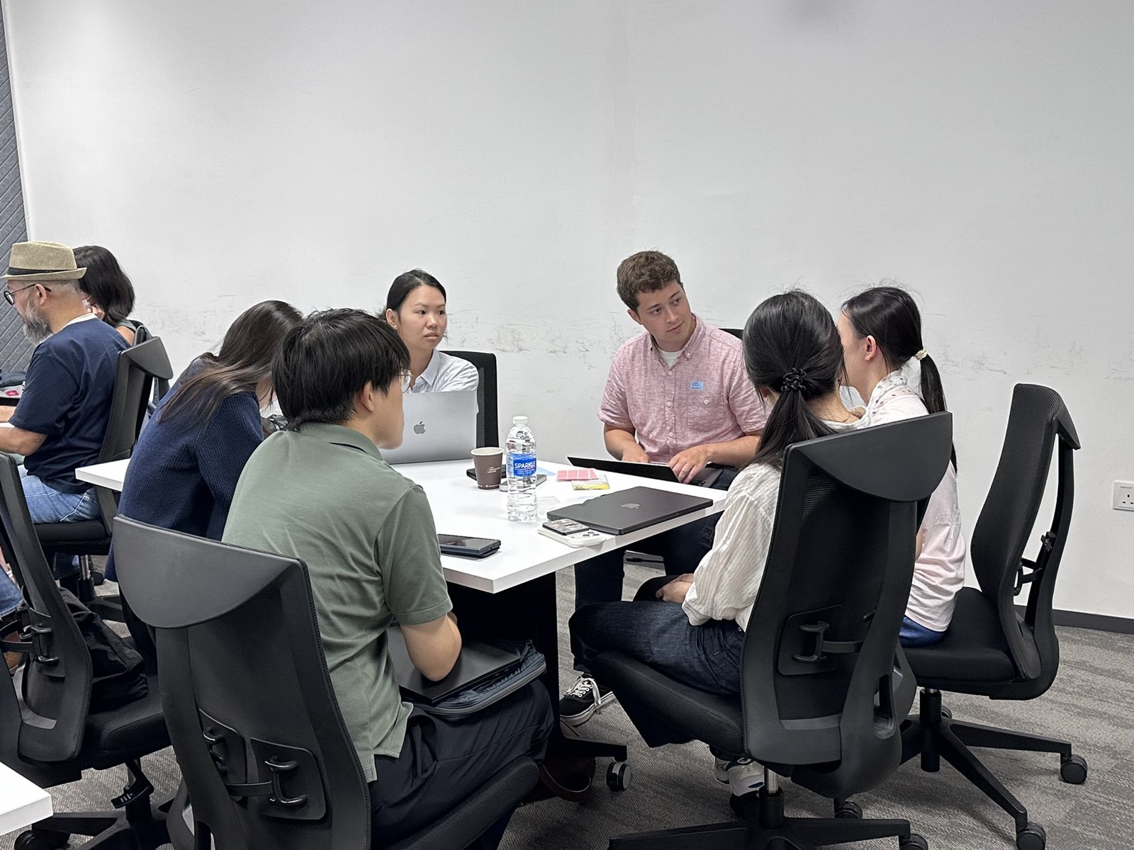 Small group breakout discussion around a table