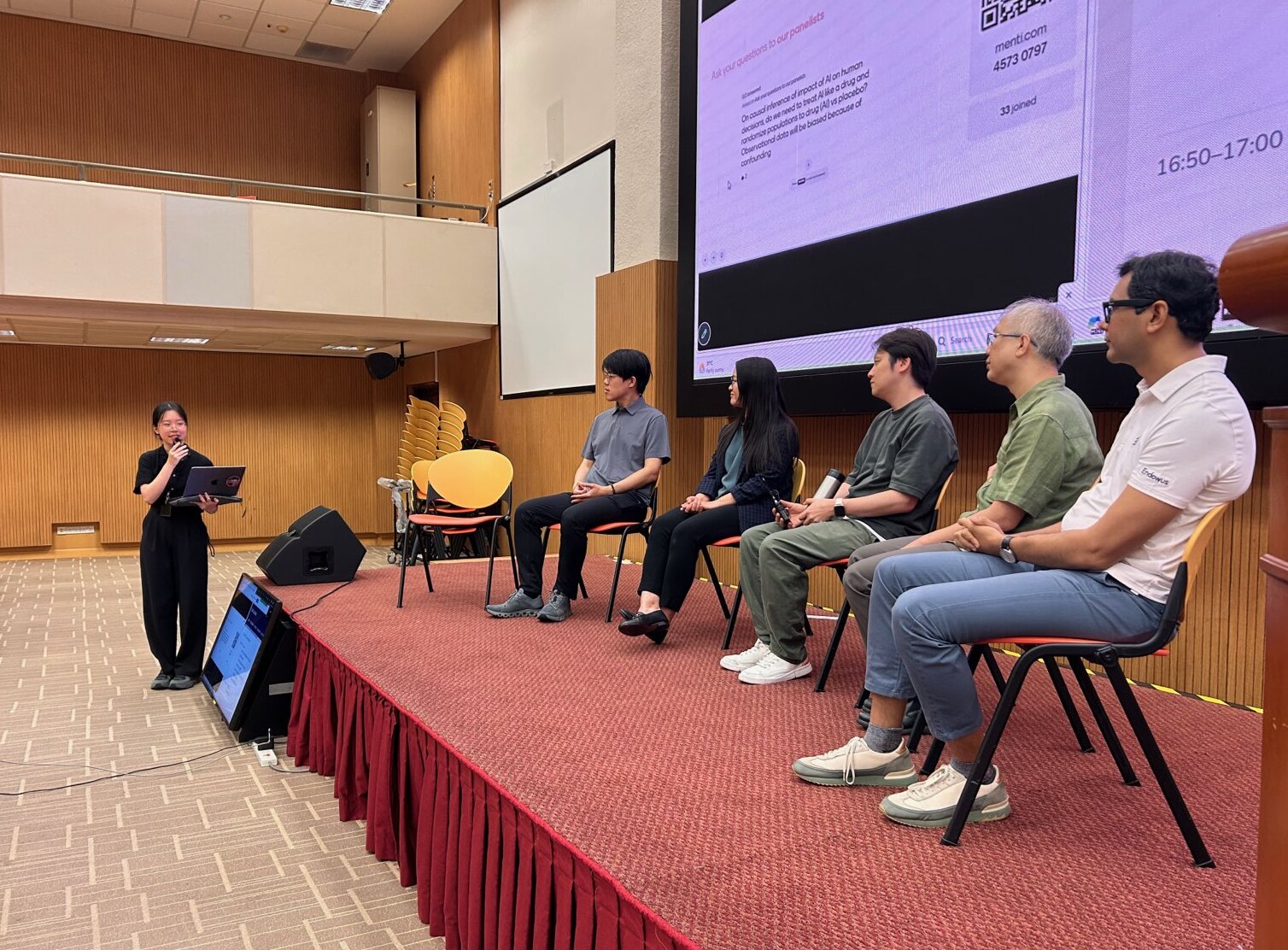 Panelists on stage for the Social Intelligence in the Age of LLMs panel